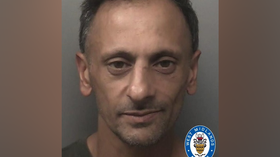 Police mugshot of Sirfraz Iqbal, looking into the camera