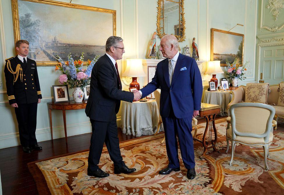 King Charles III welcomes Sir Keir Starmer during an audience at Buckingham Palace, London, where he invited the leader of the Labour Party to become Prime Minister and form a new government following the landslide General Election victory for the Labour Party, 5 July 2024.