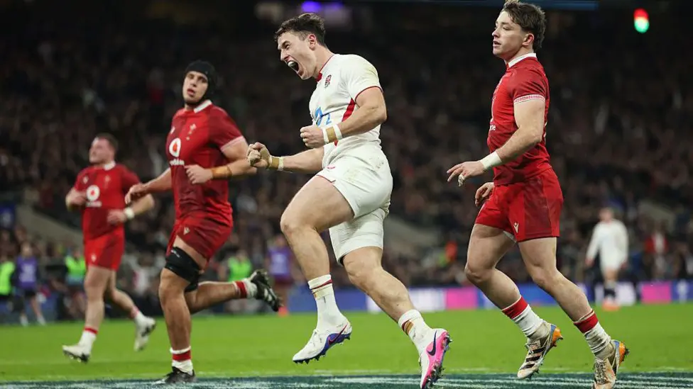 Henry Arundell celebrates scoring a try for England