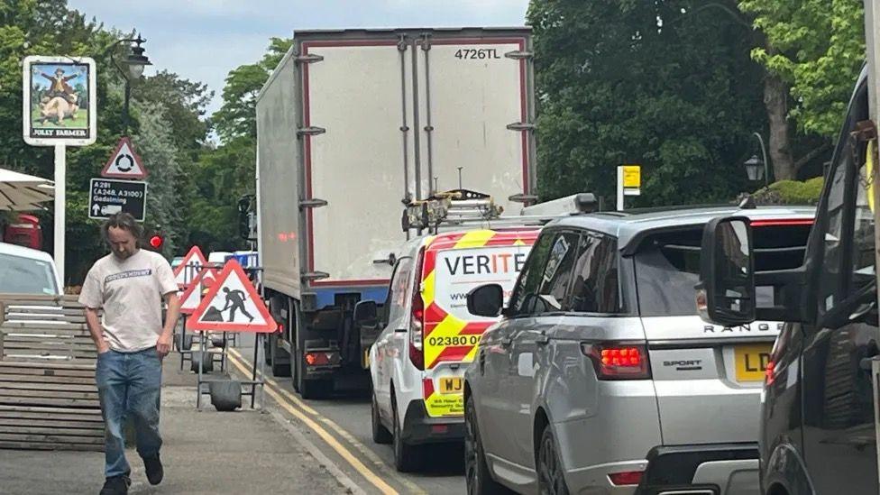 Cars queueing in Bramley due to the road closure 