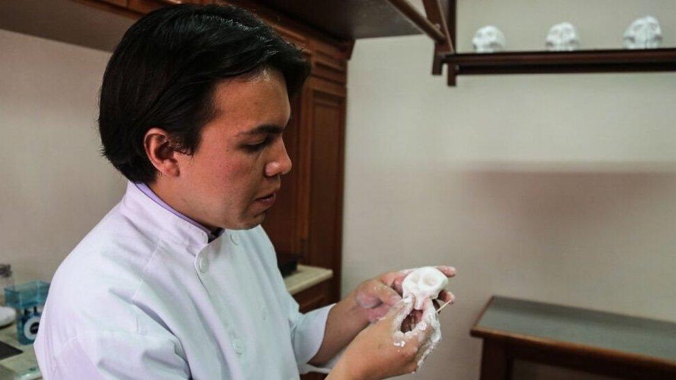 Francisco Galindo at work making sugar skulls