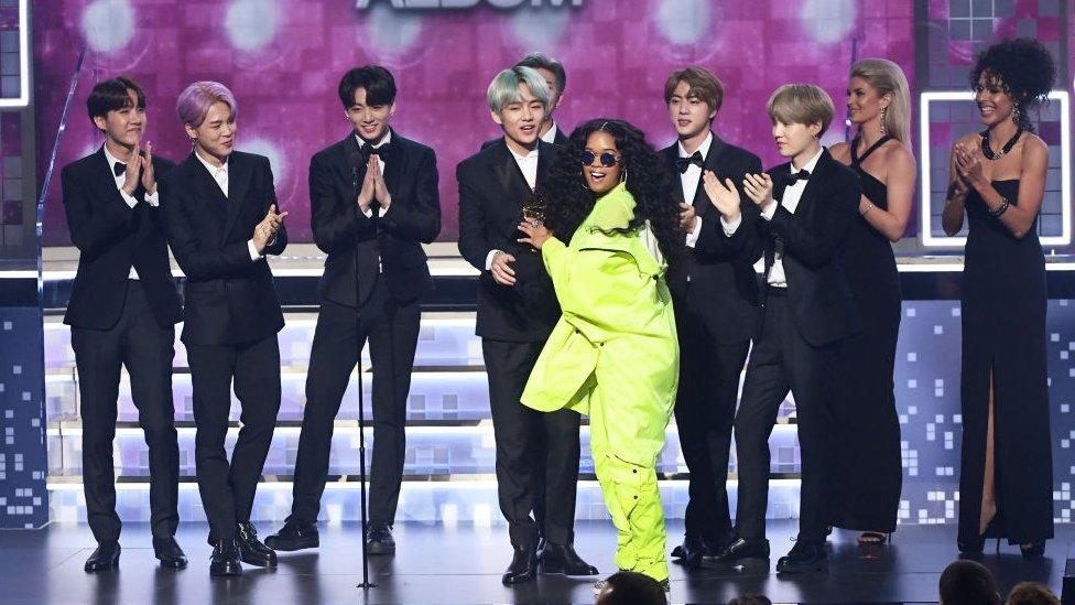 BTS on stage with H.E.R.