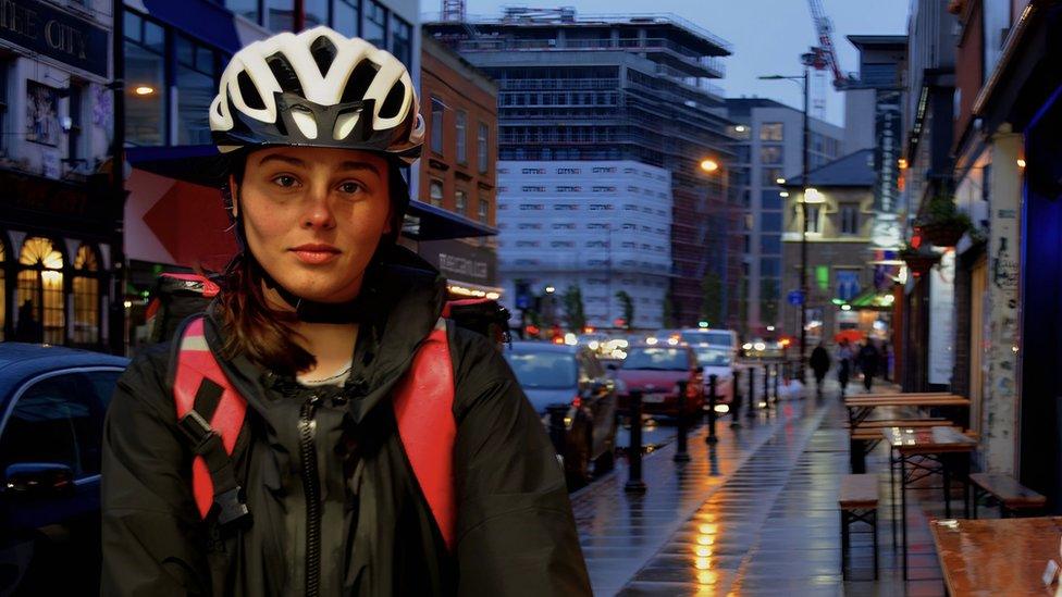 Viktória on her bike for her evening shift