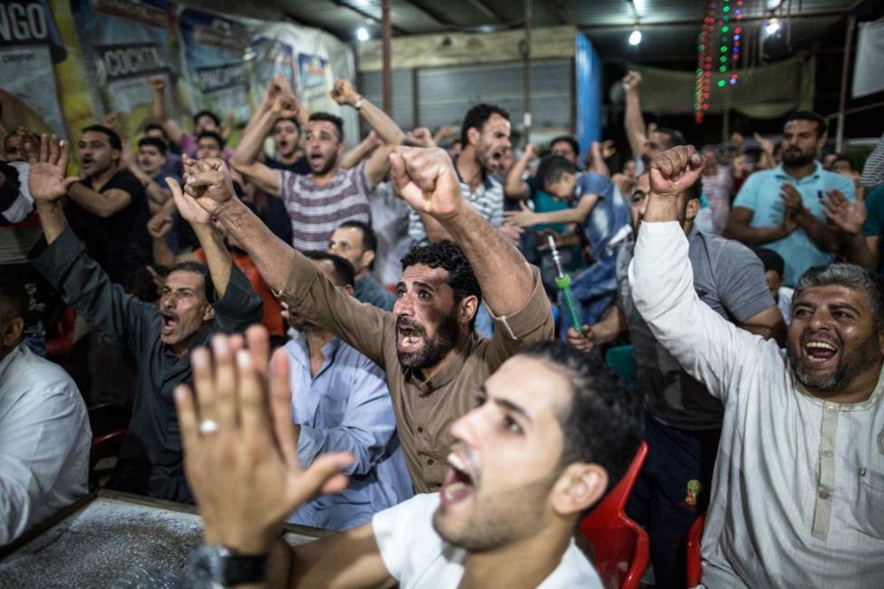 Football fans in Nagrig, Egypt celebrate after Liverpool forward Salah scores the opening goal in the 2019 Champions League final victory against Tottenham Hotspur at the Wanda Metropolitano Stadium in Madrid, Spain