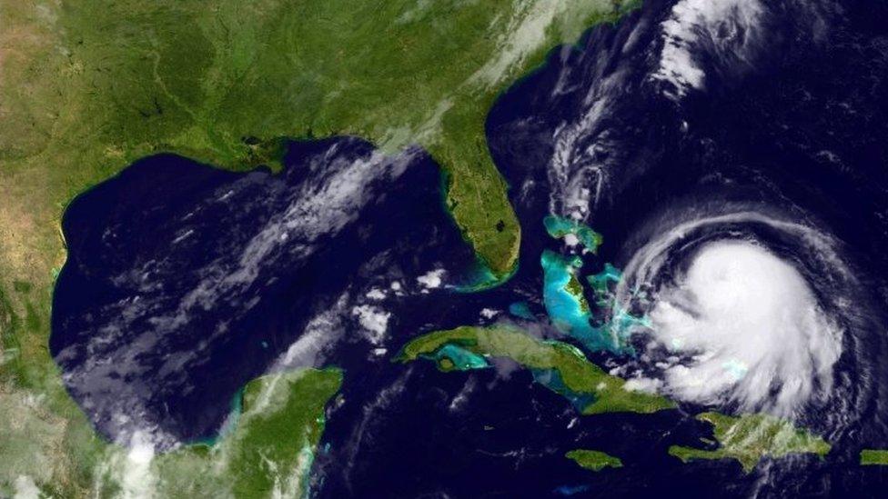 In this handout from the National Oceanic and Atmospheric Administration (NOAA), Hurricane Joaquin is seen churning in the Caribbean on 30 September, 2015.