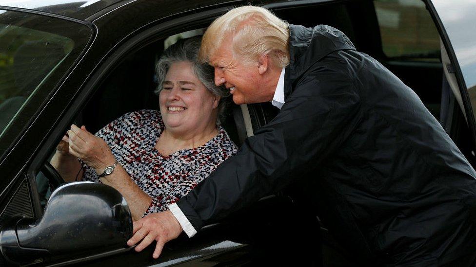 President Donald Trump poses for a selfie during a visit to meet flood survivors and volunteers in Houston, Texas, U.S., September 2, 2017