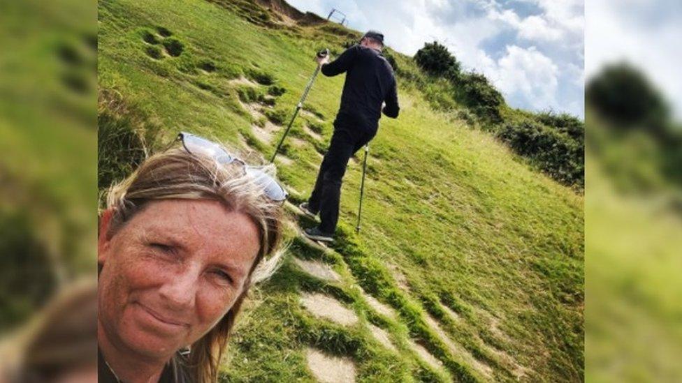 Karen and Dave on a hike after his accident.