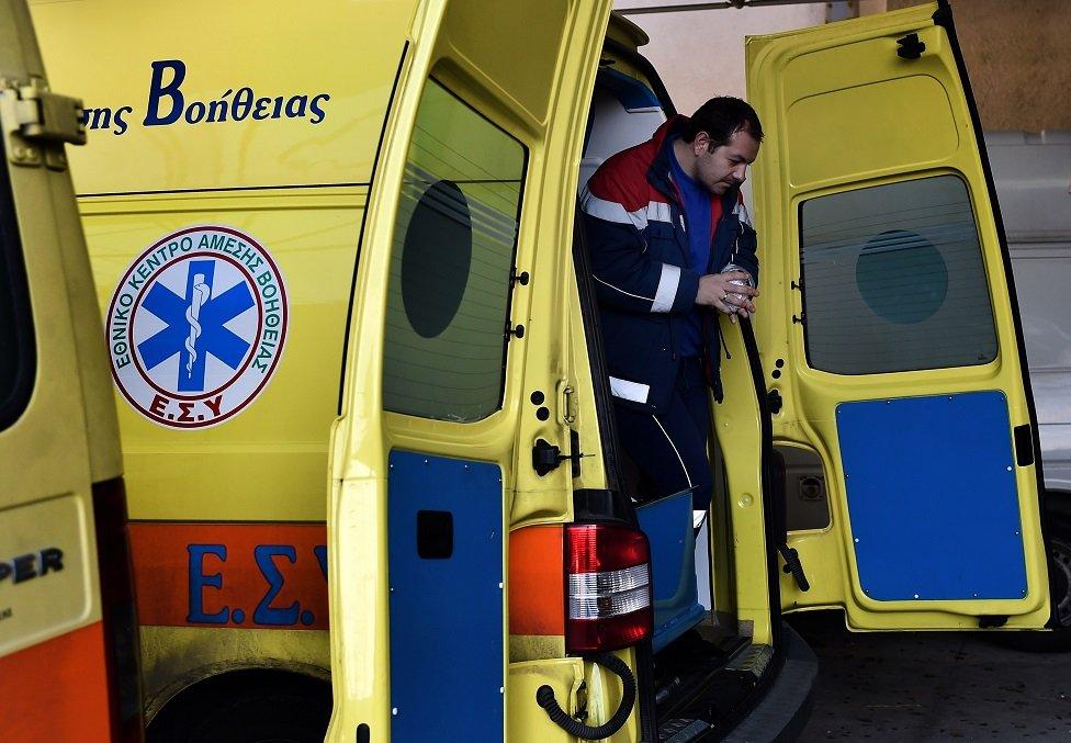 Paramedic steps out of ambulance