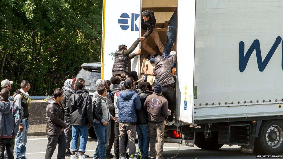 Some of the thousands of illegal immigrants camped in Calais and desperately trying to cross the Channel to reach Britain took advantage of a protest by French sailors blocking access roads to the Channel Tunnel on June 23 to climb onto stationery vehicles, said an AFP reporter on the scene.