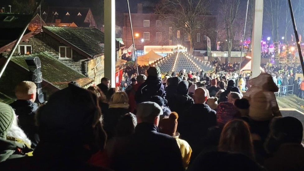 People queuing in the castle grounds