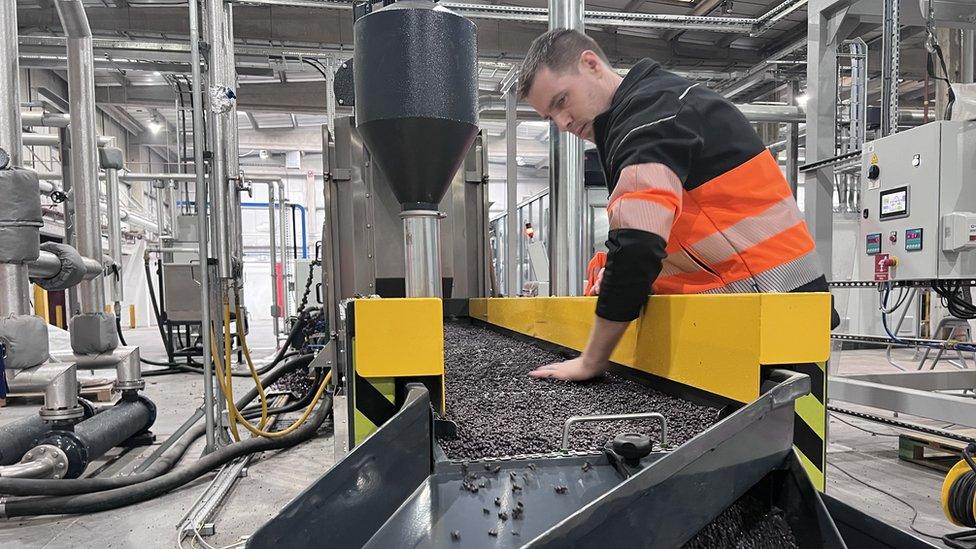 Joseph Eccleston from Innovate Recycle sorting through polypropylene pellets