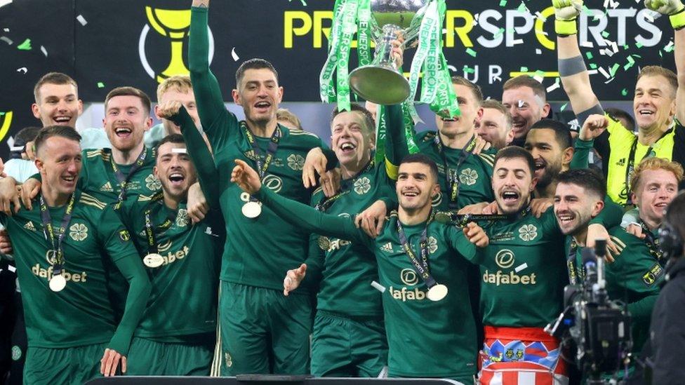 Celtic players celebrate with the trophy after winning the Premier Sports Cup Final at Hampden Park, Glasgow