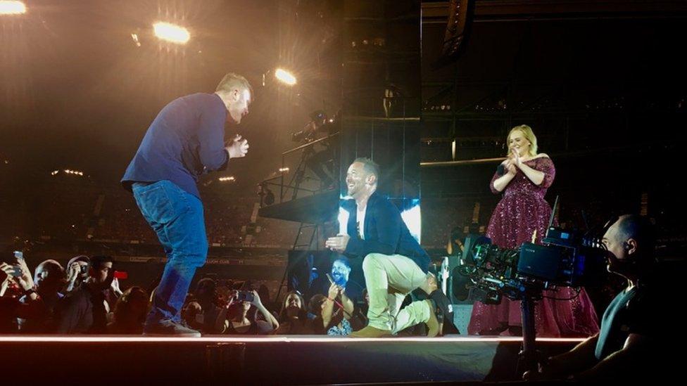 Adele watches the marriage proposal at Melbourne's Etihad Stadium