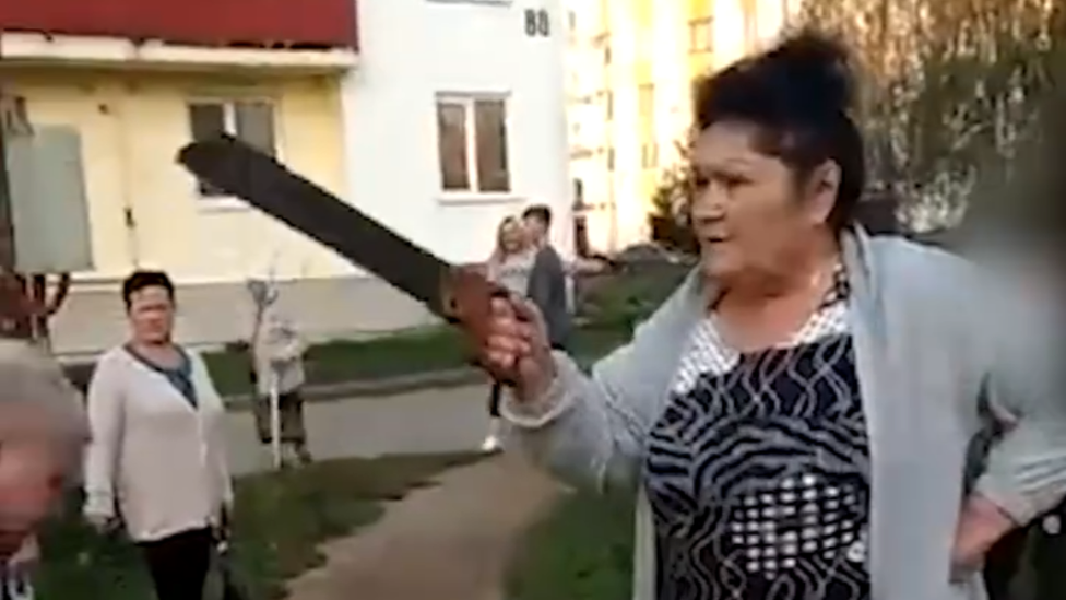 Woman with saw in Russia