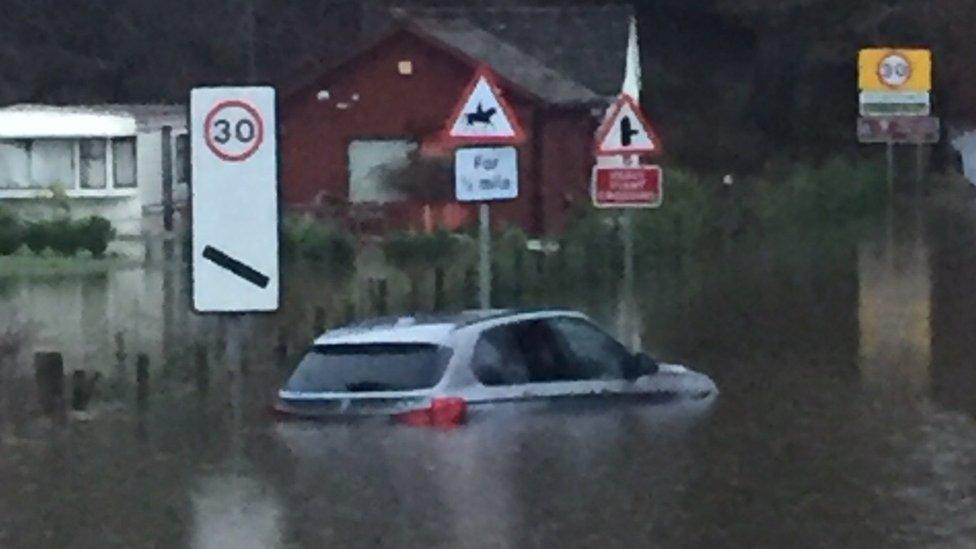 Car trapped in flood