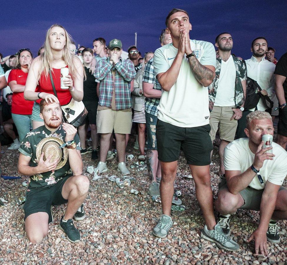 England fans celebrate on Brighton beach