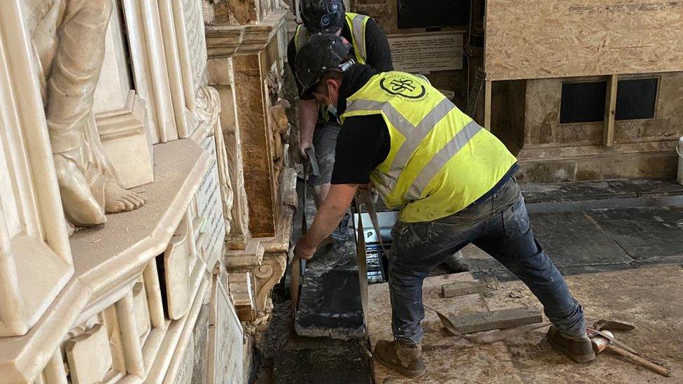 the final stone is installed in the restoration of Bath Abbey's historic floor