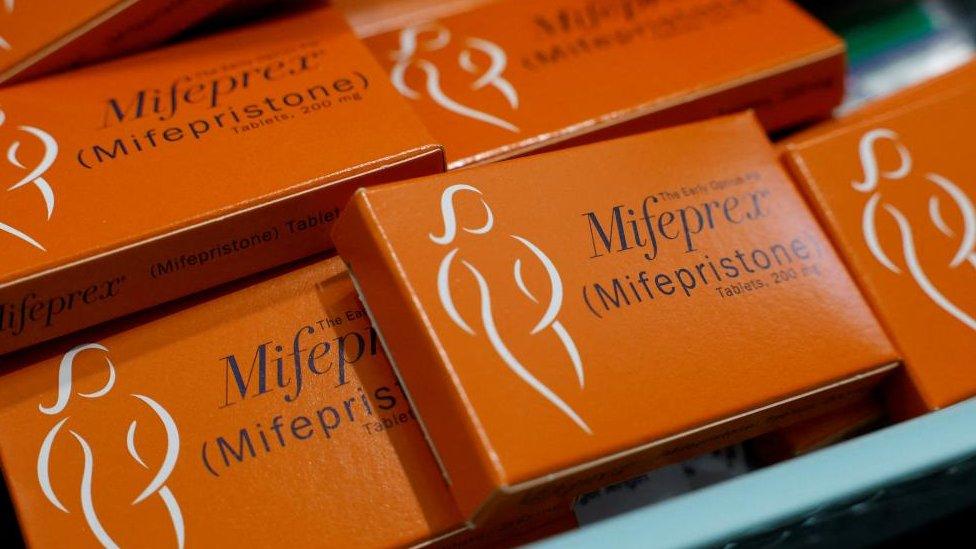 A container holding boxes of Mifepristone