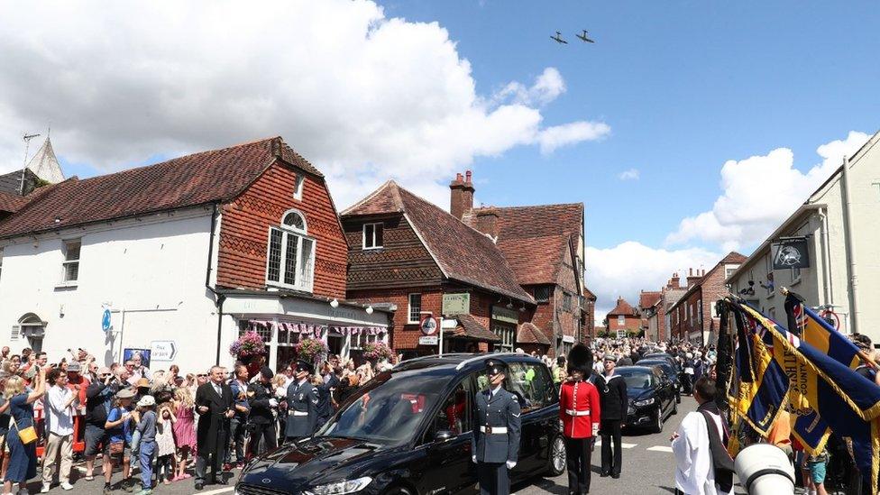 Spitfires over village