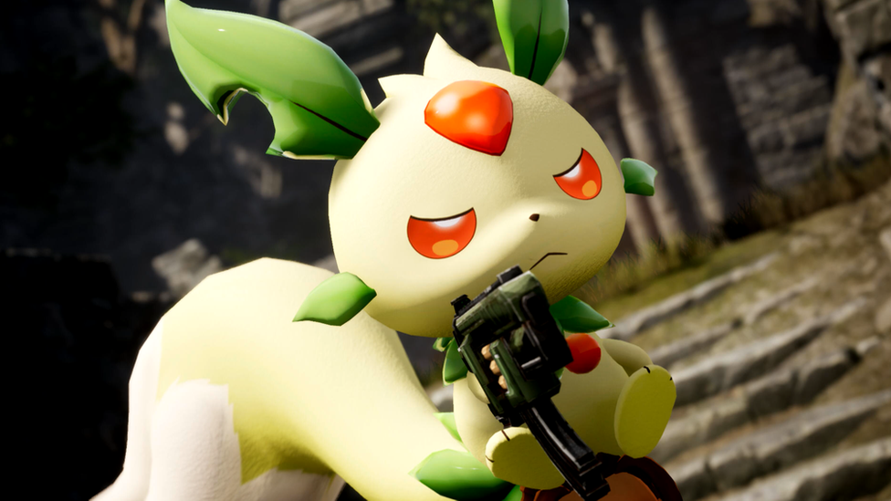 A rodent-like, cartoon creature with red eyes and green pointy ears looks menacing as it weilds a tiny machine pistol. It has a large red diamond in the center of its forehead and its feet are lifted off the ground as it balances on its oversized tail.
