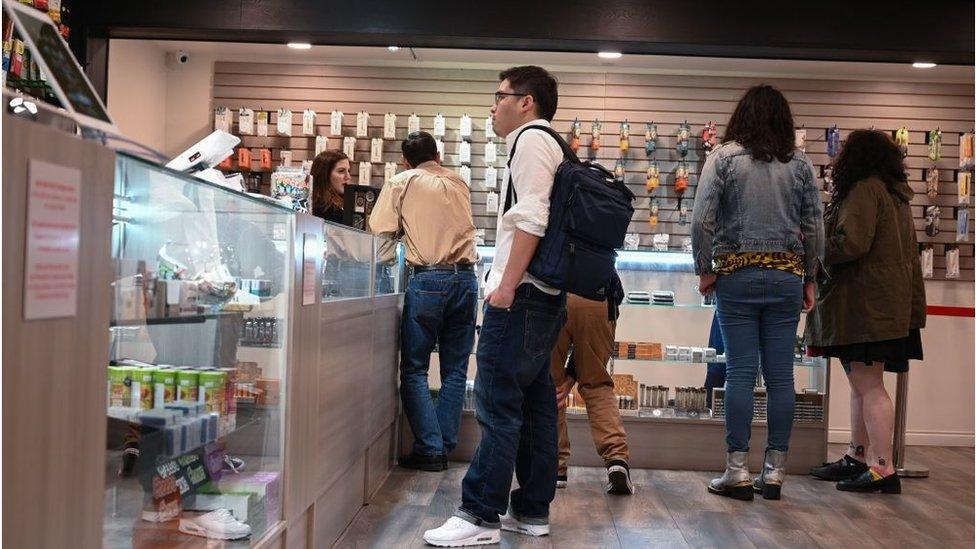 Tourists browse a marijuana shop in Los Angeles