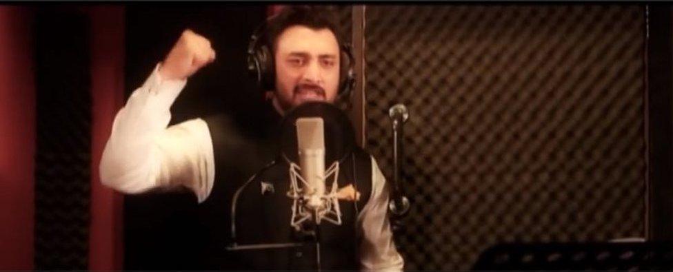 A singer raises his fist in the music video for the Kashmir Anthem Song