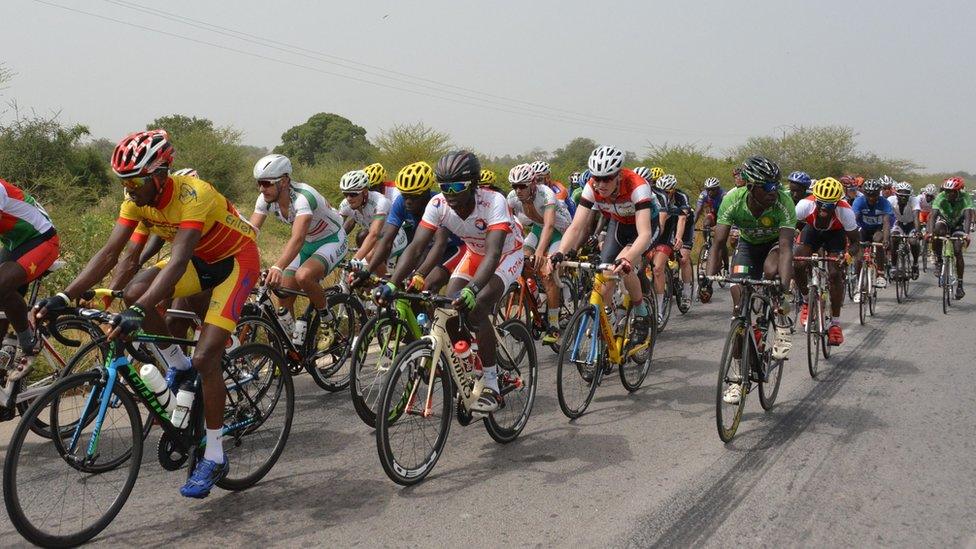 Cyclists compete during the first stage of the 29th International Cycling Tour of Burkina Faso (Tour du Faso) between Ouagadougou and Koupela on October 28, 2016.