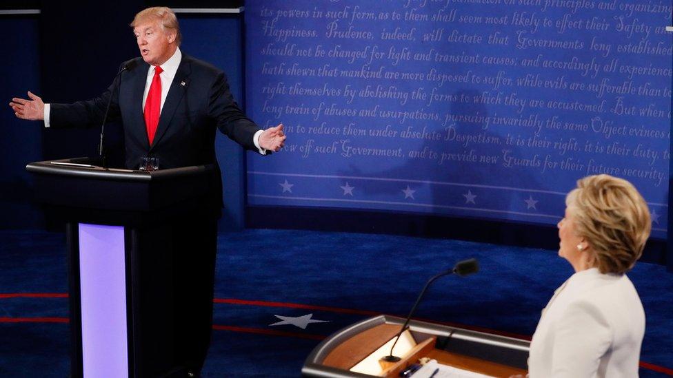 Republican presidential nominee Donald Trump (L) speaks as Democratic presidential nominee former Secretary of State Hillary Clinton looks on during the third U.S. presidential debate at the Thomas Mack Center on October 19, 2016 in Las Vegas, Nevada