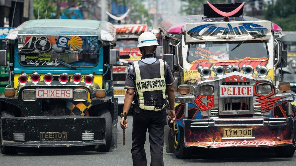 Jeepneys on a busy street in Manila