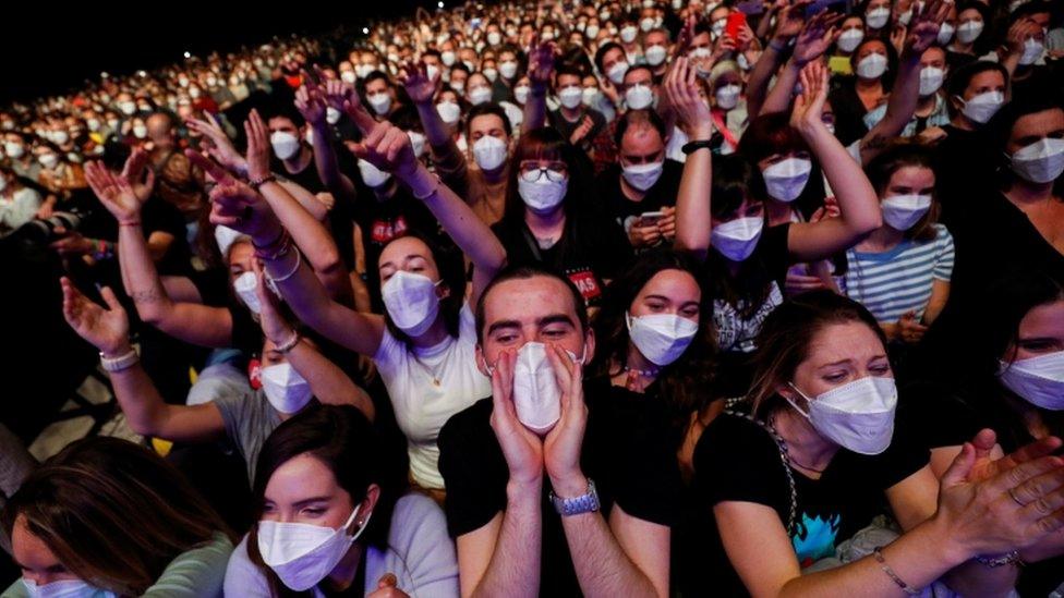 Masked music fans at the concert