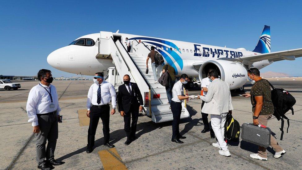 EgyptAir crew check the documents of travellers at Sharm el-Sheikh international airport (20 June 2020)