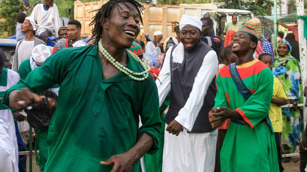 A Sufi Muslim wearing green performs a traditional dance during a festival commemorating the birth of Islam's Prophet Muhammed in Gadaref, Sudan -  Wednesday 4 September 2024.