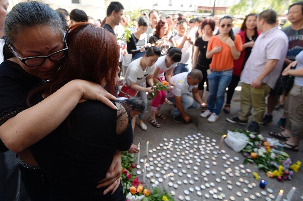 Tributes outside the town hall in Aubervilliers, north-eastern suburbs of Paris, 14 August