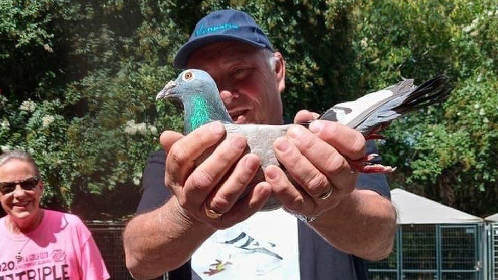 Alan Todd holding Bob at the animal shelter in Alabama