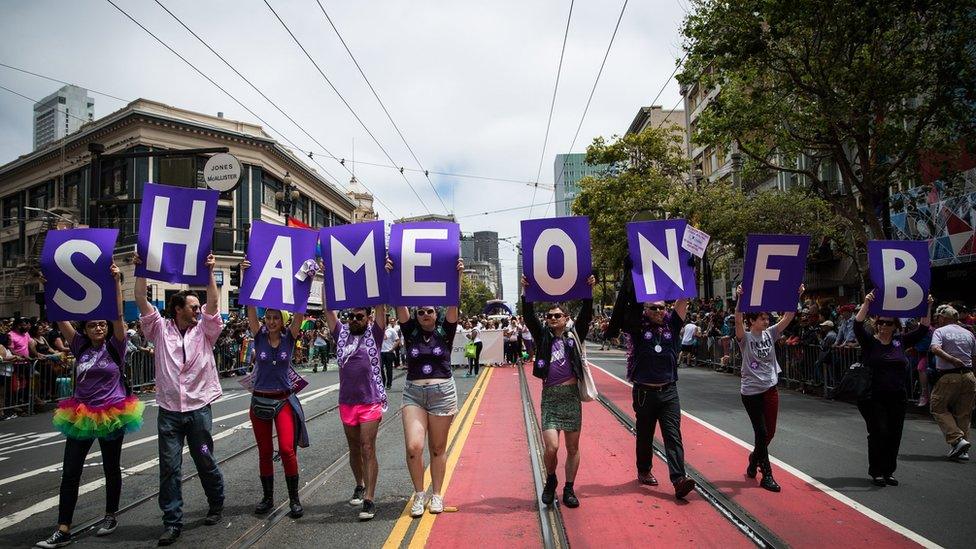 San Francisco Gay Pride Parade marchers protest Facebook not allowing transgender people from choosing their own name, rather than birth name on the social networking site, June 28, 2015 in San Francisco,