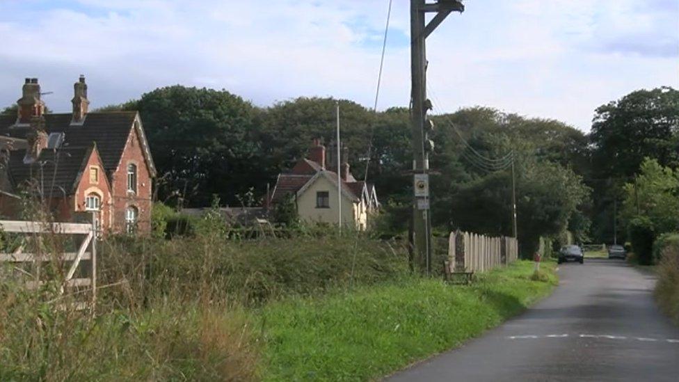 Village of Grimston with graffiti on the road