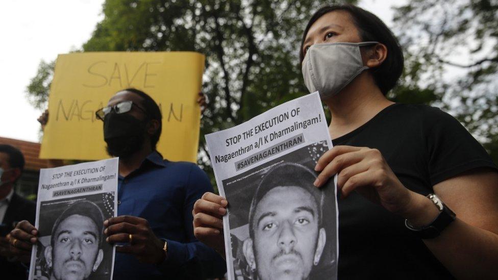 Activists hold a poster of Nagaenthran Dharmalingam in Kuala Lumpur, Malaysia