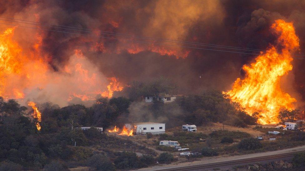 Fires rage near a highway in California in December 2017.