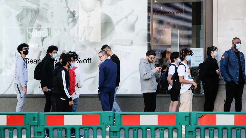 Shoppers queuing outside Niketown, Oxford Circus