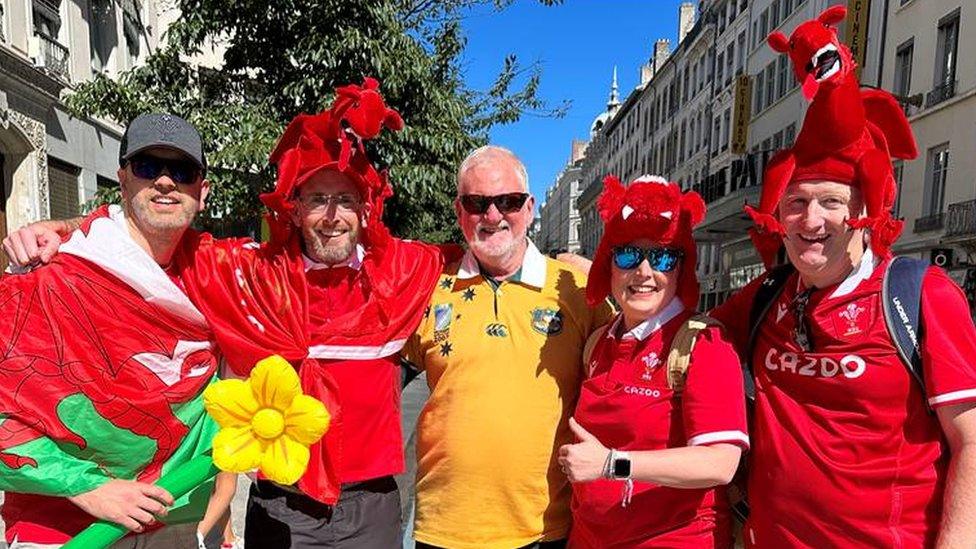 Welsh rugby fans in Lyon, including Colin from Bridgend on the right in the dragon hat