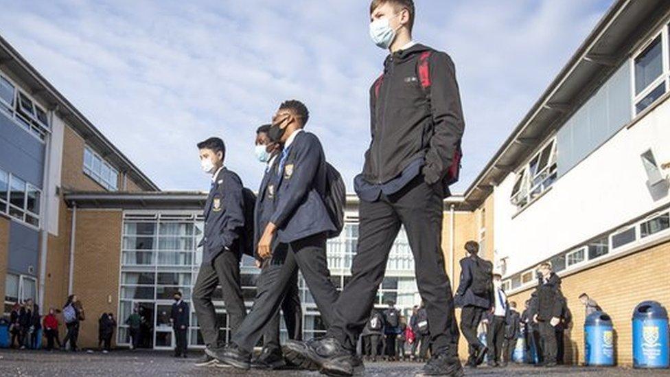 Pupils arrive at school