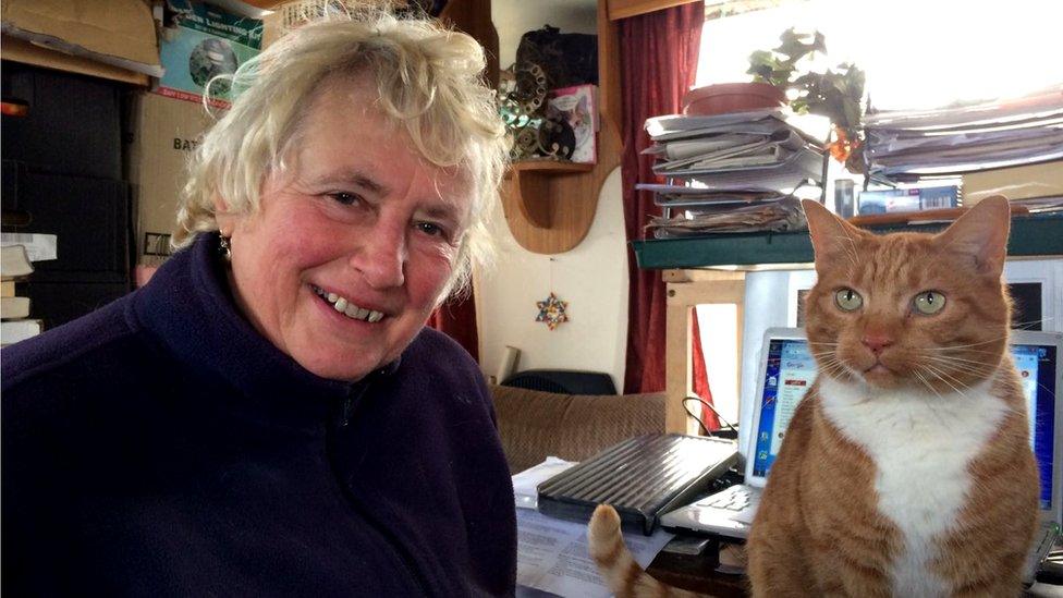 Bryony Nierop-Reading and her cat inside the temporary home