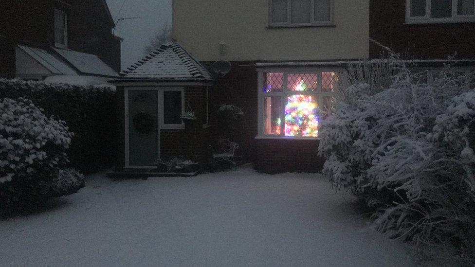 A Christmas tree lit inside a home