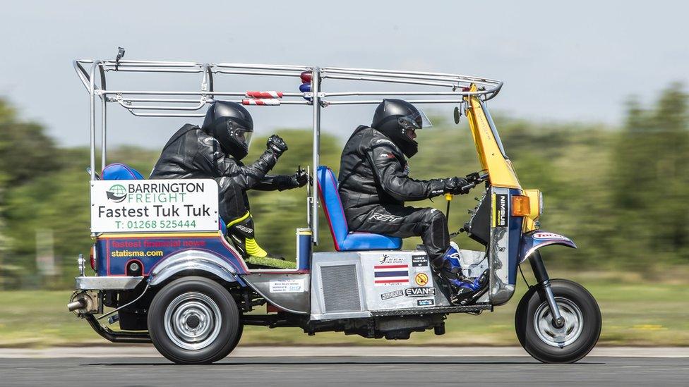 Essex businessman Matt Everard drives his tuk tuk during a world speed record attempt at Elvington Airfield, North Yorkshire.