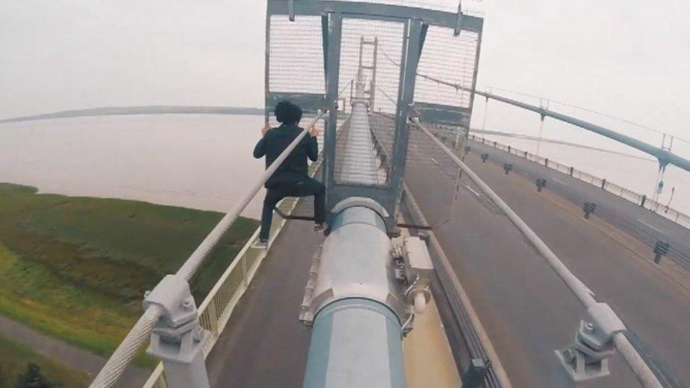 Man climbing Humber Bridge