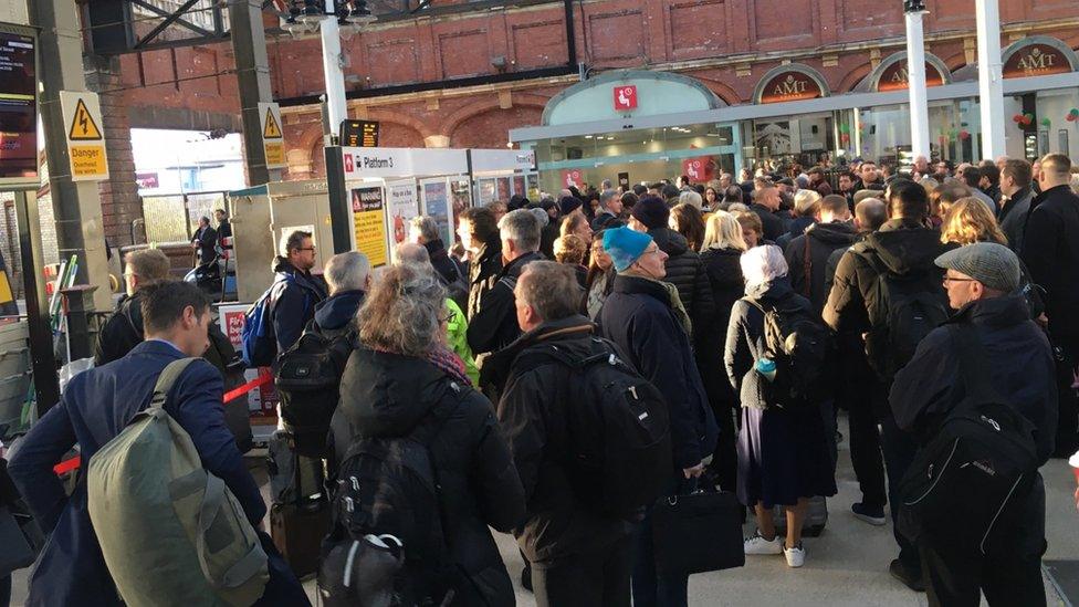 Passengers at Norwich railway station after a train cancellation