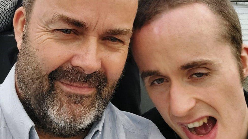 David King from Westbury smiling next to his severely autistic son, Callum