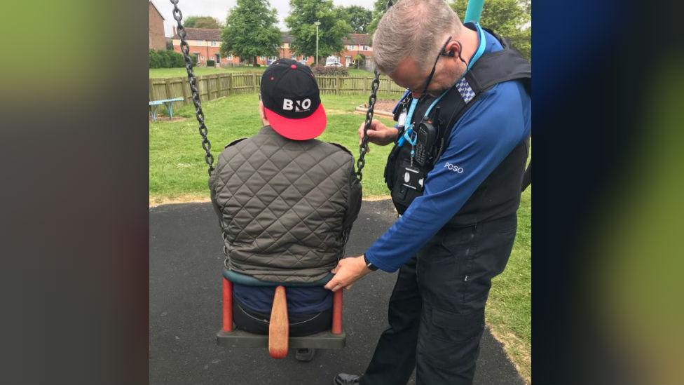 PCSO with man stuck in swing