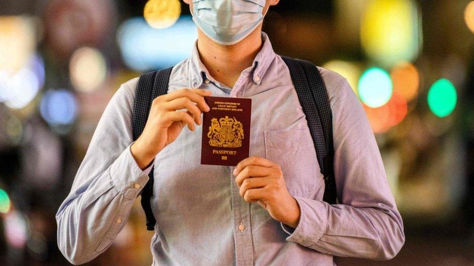 Cropped photographs shows Hong Kong president posing with his British National (Overseas) passport