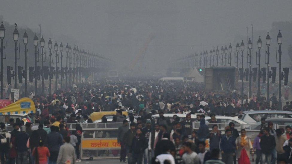 NEW DELHI, INDIA JANUARY 1: Massive crowds of people arrived on New Year's Day on a cold evening at Kartavya Path near India Gate, on January 1, 2024 in New Delhi, India. The Meteorological Department said that dense fog is expected in Delhi-NCT for the next two days. The impact of the weather will be visible on transport services. The Meteorological Department also issued a cold wave warning in Delhi-NCR. (Photo by Raj K Raj/Hindustan Times via Getty Images)